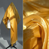 金黄色水晶亮光感欧根纱加密顺滑薄款网纱布料，礼服服装设计师面料