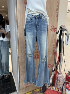 2024年韩版早春通勤风韩国东大门修身个性破洞设计牛仔女长裤