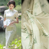 竹叶绿色旗袍布料植物图案，创意印染国风旗袍，连衣裙服装设计师面料